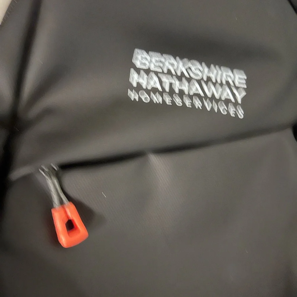 Waterproof Travel Sling Bag- Unisex. Black with Orange accents.